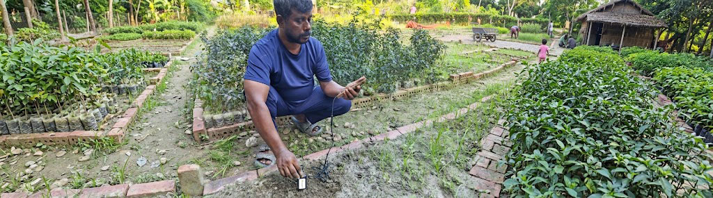 Genius Farms team discussing the Soil Sensor Pro